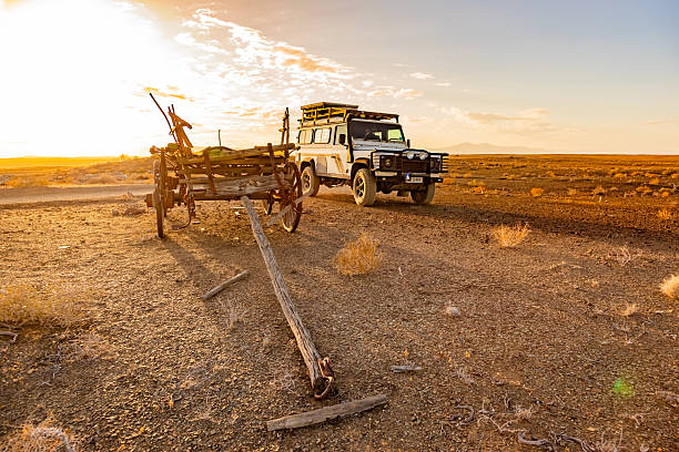 Karoo, South Africa - October 27, 2025: Old Land Rover Defender parked in an arid region