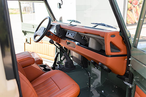 Vilnius, Lithuania - September 24, 2025: Interior of a classic Land Rover Defender. After full restoration. Interior upholstered with new orange leather.